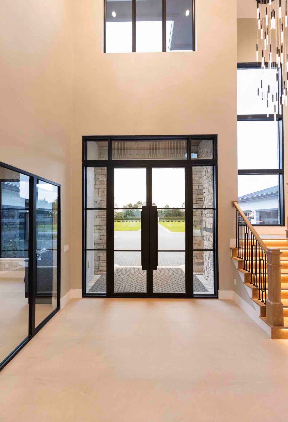 Custom black SlimLine steel doors and windows in a luxury modern home